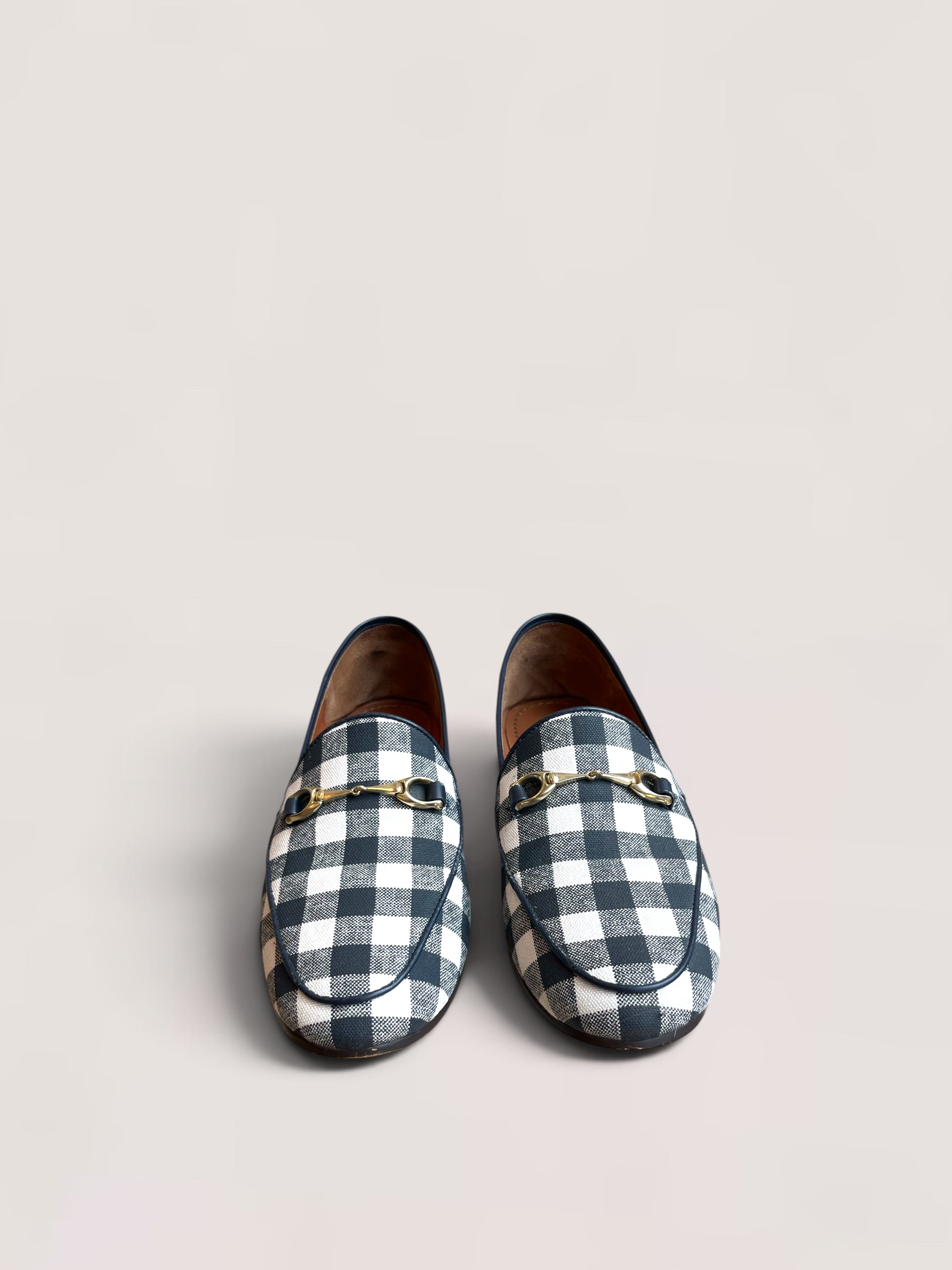 Black and white checked Coach loafers